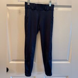 Ovation girls size 10 Navy riding tights. Silicone knee patches. Belt loops.